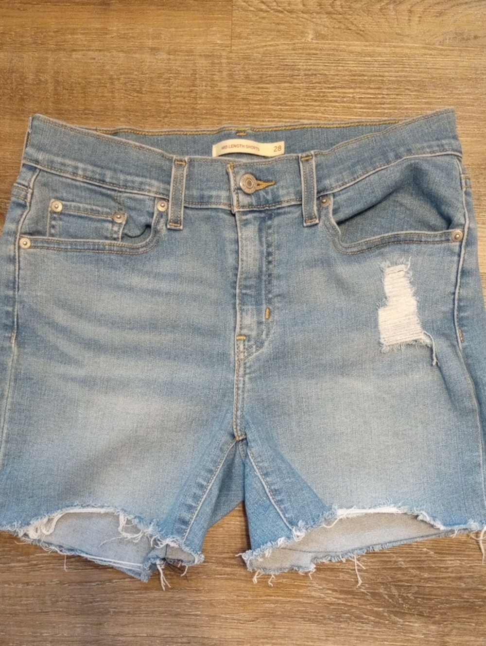 Levi's Mid Length Light Blue Distressed Denim Shorts Size 28
